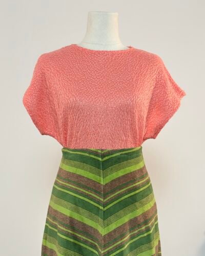 Top de punto rosa chicle con manga murciélago