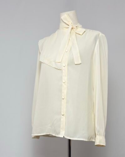 Blusa manga larga cuello bebé asimétrico